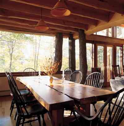 
The dining table was a special find. A local craftsman constructed it from cherry scrap that had been destined for workbench status. The custom-designed Windsor chairs that complement it are sturdy and yet lightweight. A local craftsman lathed the lamp shades from blocks of wood.
